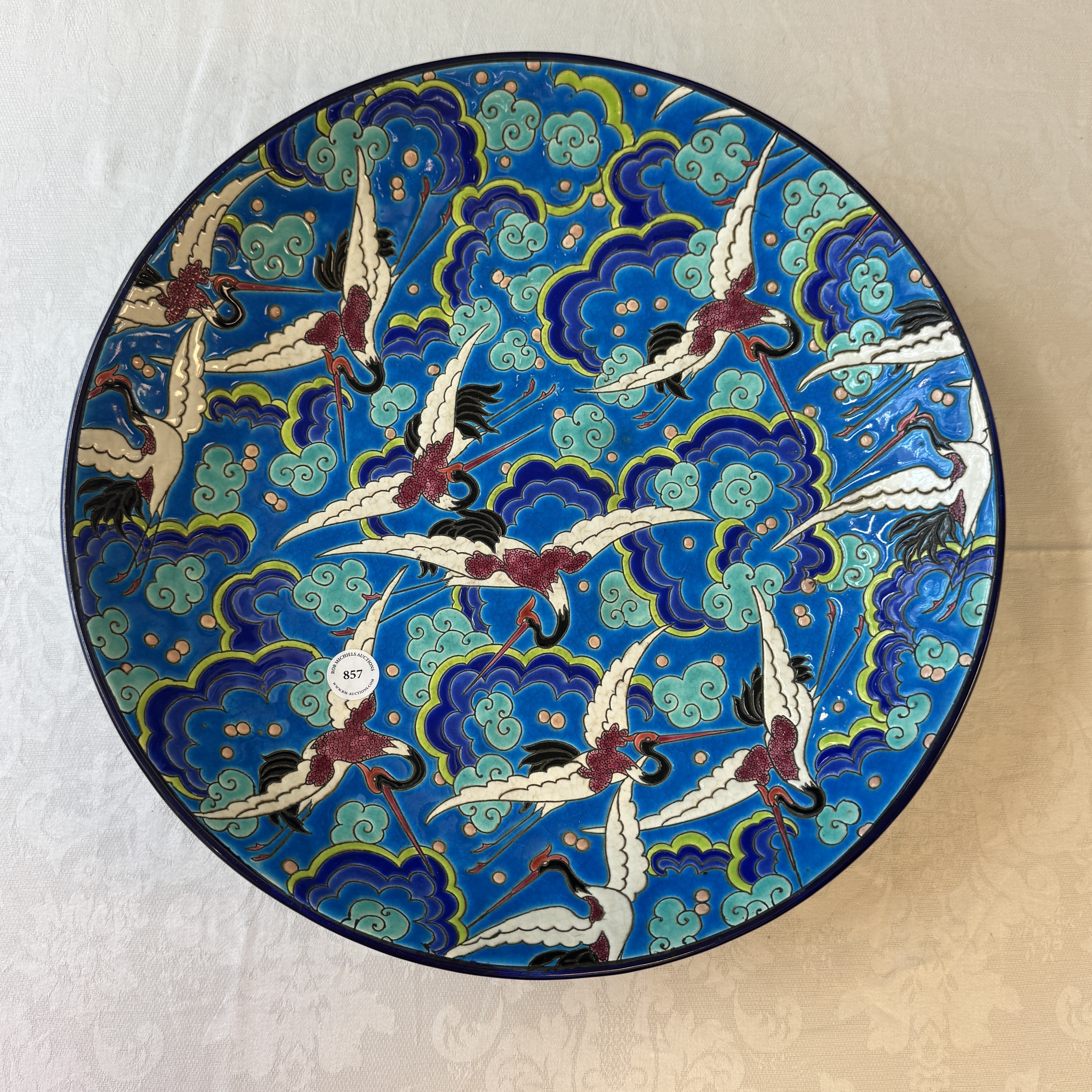 A French polychrome enamelled Longwy 'Cranes among Clouds' charger — photo 1