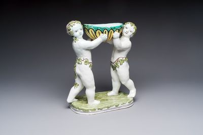 A French polychrome faience group with two Bacchus figures, Geo Martel, Dèsvres, early 20th C.