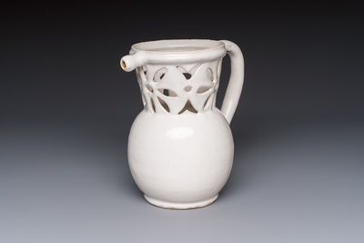 A French white-glazed puzzle jug, Nevers, 18th C.