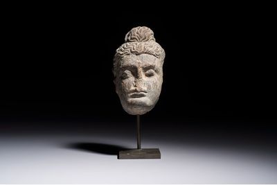 A Gandhara grey schist relief fragment of a Bodhisattva head, 3rd/4th C.
