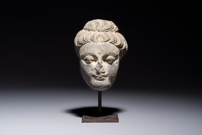 A Gandhara grey schist relief fragment of a Bodhisattva head, 3rd/4th C.