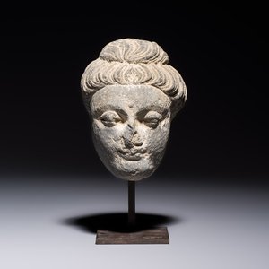 A Gandhara grey schist relief fragment of a Bodhisattva head, 3rd/4th C. — photo 1