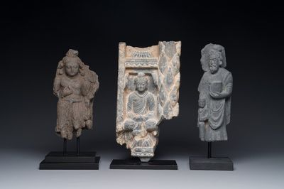 A Gandhara grey schist sculpture of the Bodhisattva Maitreya, a fragment of a seated Buddha and a sculpture of a master with a child, 1/5th C.