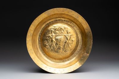 A German brass repoussé 'the Grapes of Canaan' dish, Nuremberg, 17th C.