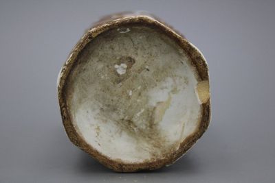 A German relief-decorated Ansbach or Berlin vase, 18th C.
