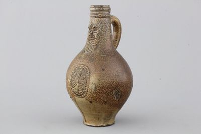A German stoneware bellarmine jug, 17th C.