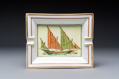 A gilt and polychrome-decorated porcelain 'Yacht' ashtray, Hermès, 20th C.