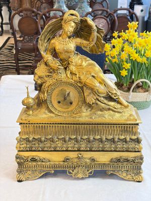 A gilt-bronze 'Oriental Beauty Reclining on a Lion Skin' mantel clock, France, first quarter 19th C. — photo 1