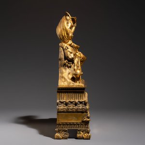 A gilt-bronze 'Oriental Beauty Reclining on a Lion Skin' mantel clock, France, first quarter 19th C. — photo 5