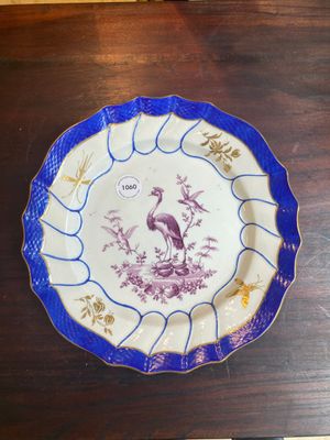 A gilt puce-enamelled 'birds' plate with a blue-enamelled border, Tournai, 18th C. — photo 1
