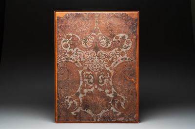 A gold leather fragment with floral design mounted on a wooden panel, Mechelen, 18th C.