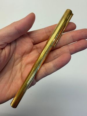 A gold-plated twist ballpoint pen and a fountain pen with an 18kt gold nib, S.T. Dupont Paris, France, 20th C. — photo 1