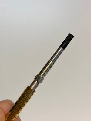 A gold-plated twist ballpoint pen and a fountain pen with an 18kt gold nib, S.T. Dupont Paris, France, 20th C. — photo 13