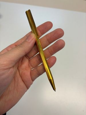 A gold-plated twist ballpoint pen and a fountain pen with an 18kt gold nib, S.T. Dupont Paris, France, 20th C. — photo 14