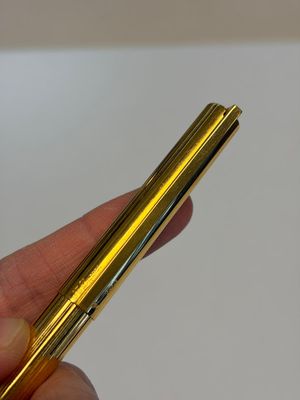 A gold-plated twist ballpoint pen and a fountain pen with an 18kt gold nib, S.T. Dupont Paris, France, 20th C. — photo 2