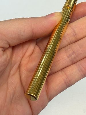 A gold-plated twist ballpoint pen and a fountain pen with an 18kt gold nib, S.T. Dupont Paris, France, 20th C. — photo 3