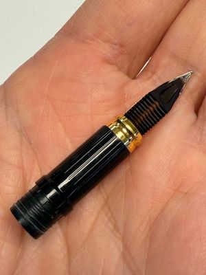 A gold-plated twist ballpoint pen and a fountain pen with an 18kt gold nib, S.T. Dupont Paris, France, 20th C. — photo 7
