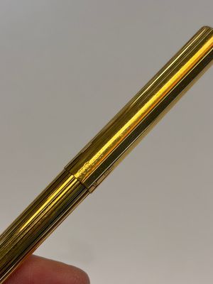 A gold-plated twist ballpoint pen and a fountain pen with an 18kt gold nib, S.T. Dupont Paris, France, 20th C. — photo 8