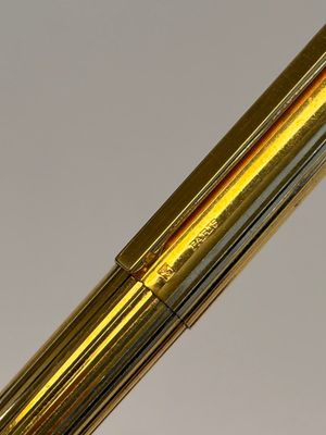 A gold-plated twist ballpoint pen and a fountain pen with an 18kt gold nib, S.T. Dupont Paris, France, 20th C. — photo 9