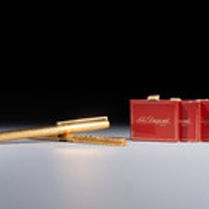 A gold-plated twist ballpoint pen and a fountain pen with an 18kt gold nib, S.T. Dupont Paris, France, 20th C. — photo 1