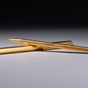 A gold-plated twist ballpoint pen and a fountain pen with an 18kt gold nib, S.T. Dupont Paris, France, 20th C. — photo 2