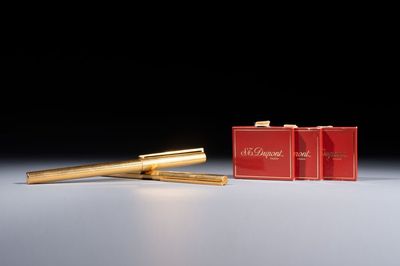 A gold-plated twist ballpoint pen and a fountain pen with an 18kt gold nib, S.T. Dupont Paris, France, 20th C.