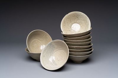 A group of 12 Chinese celadon-glazed bowls with incised floral design from the Jepara shipwreck, Fujian kilns, Song