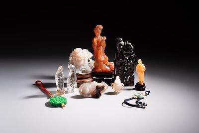 A group of ten Chinese hardstone and cherry amber carvings, 20th C.