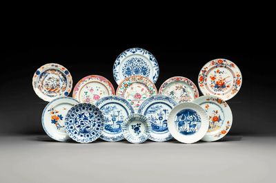 A group of thirteen Chinese blue, white and famille rose plates and a bowl, late Ming/early Qing