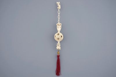 A hanging Chinese ivory puzzle ball, Canton, 19th C.