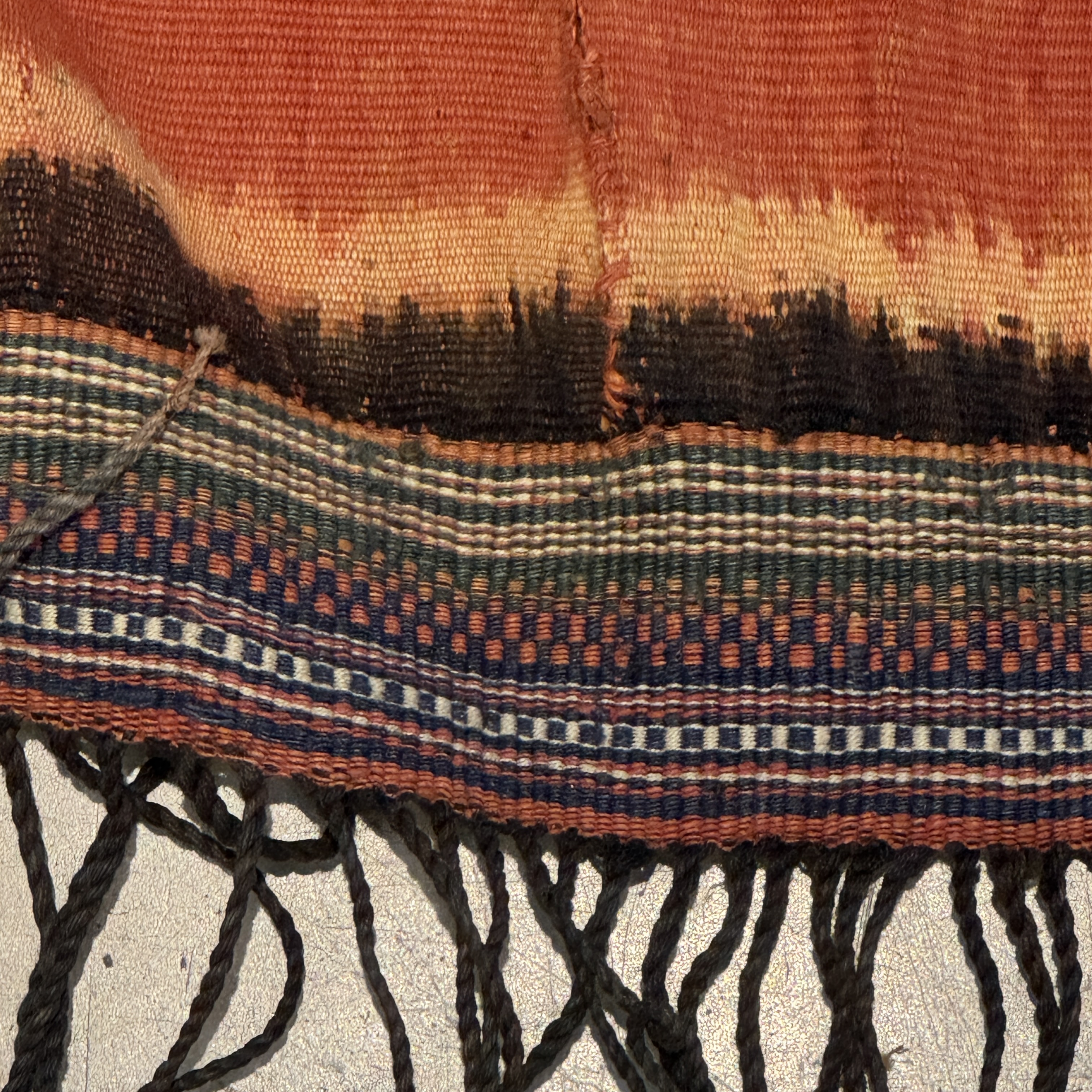 A hinggi shoulder cloth with warrior motifs and an Iban pua textile with human and animal motifs — photo 6