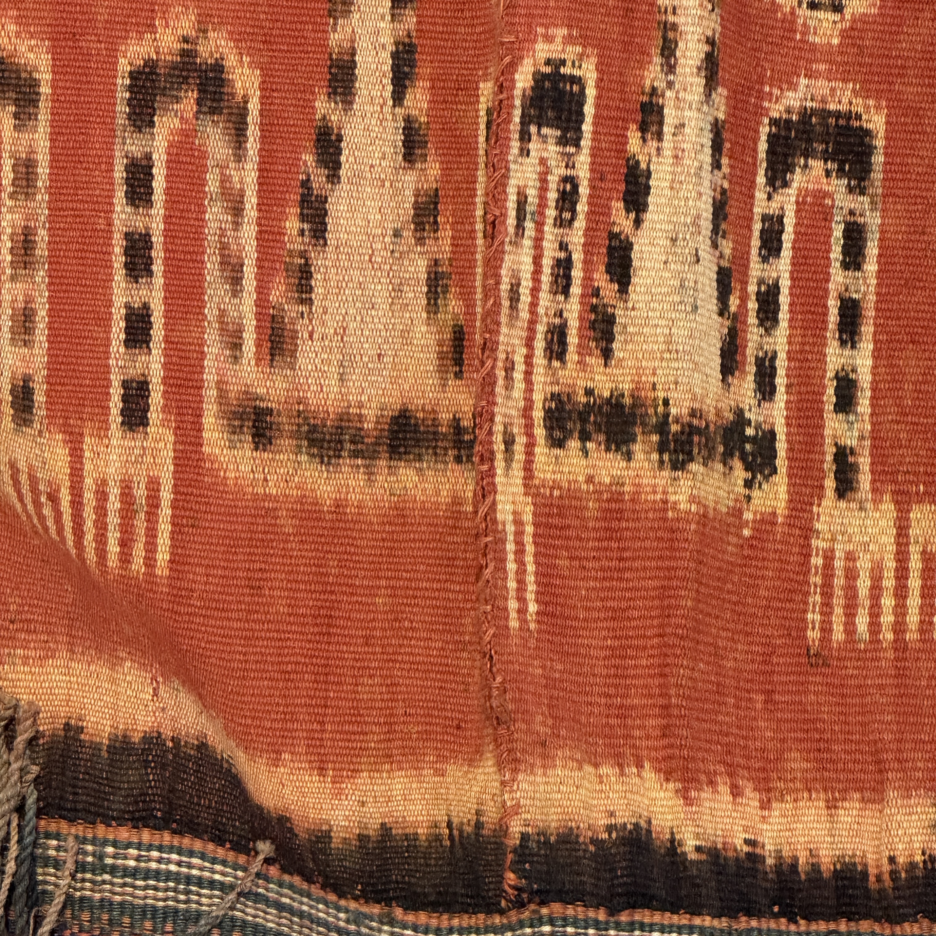 A hinggi shoulder cloth with warrior motifs and an Iban pua textile with human and animal motifs — photo 7