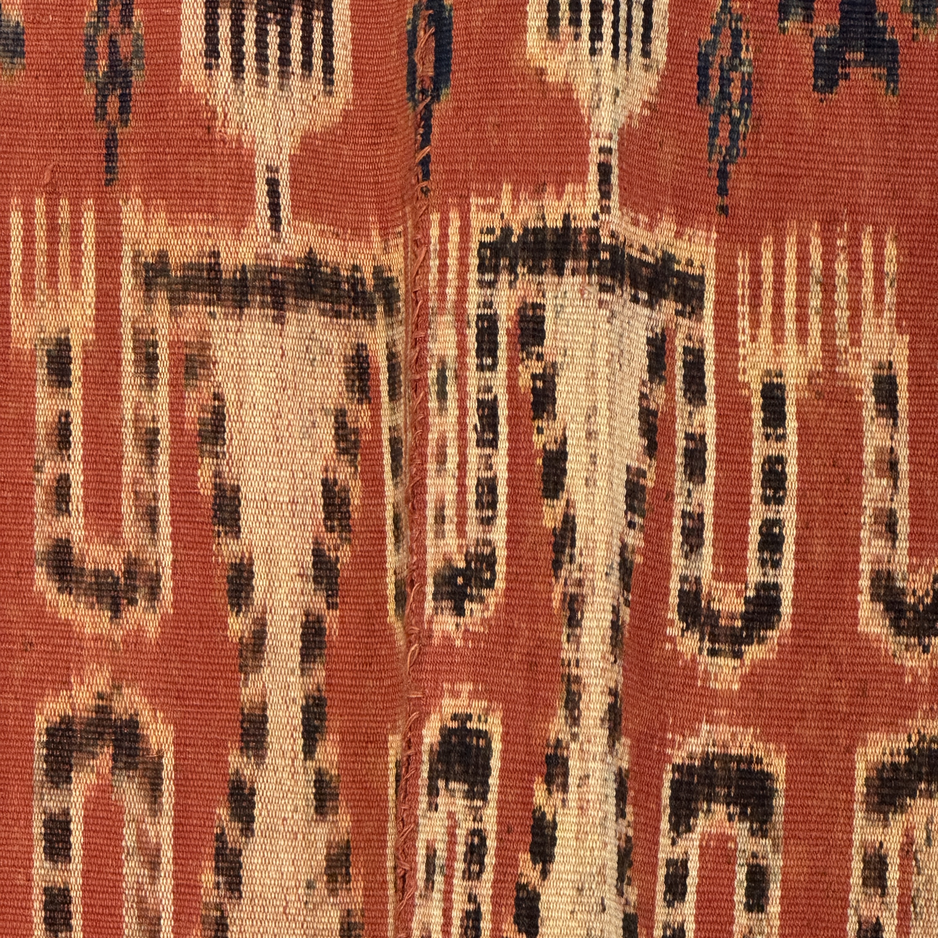 A hinggi shoulder cloth with warrior motifs and an Iban pua textile with human and animal motifs — photo 8