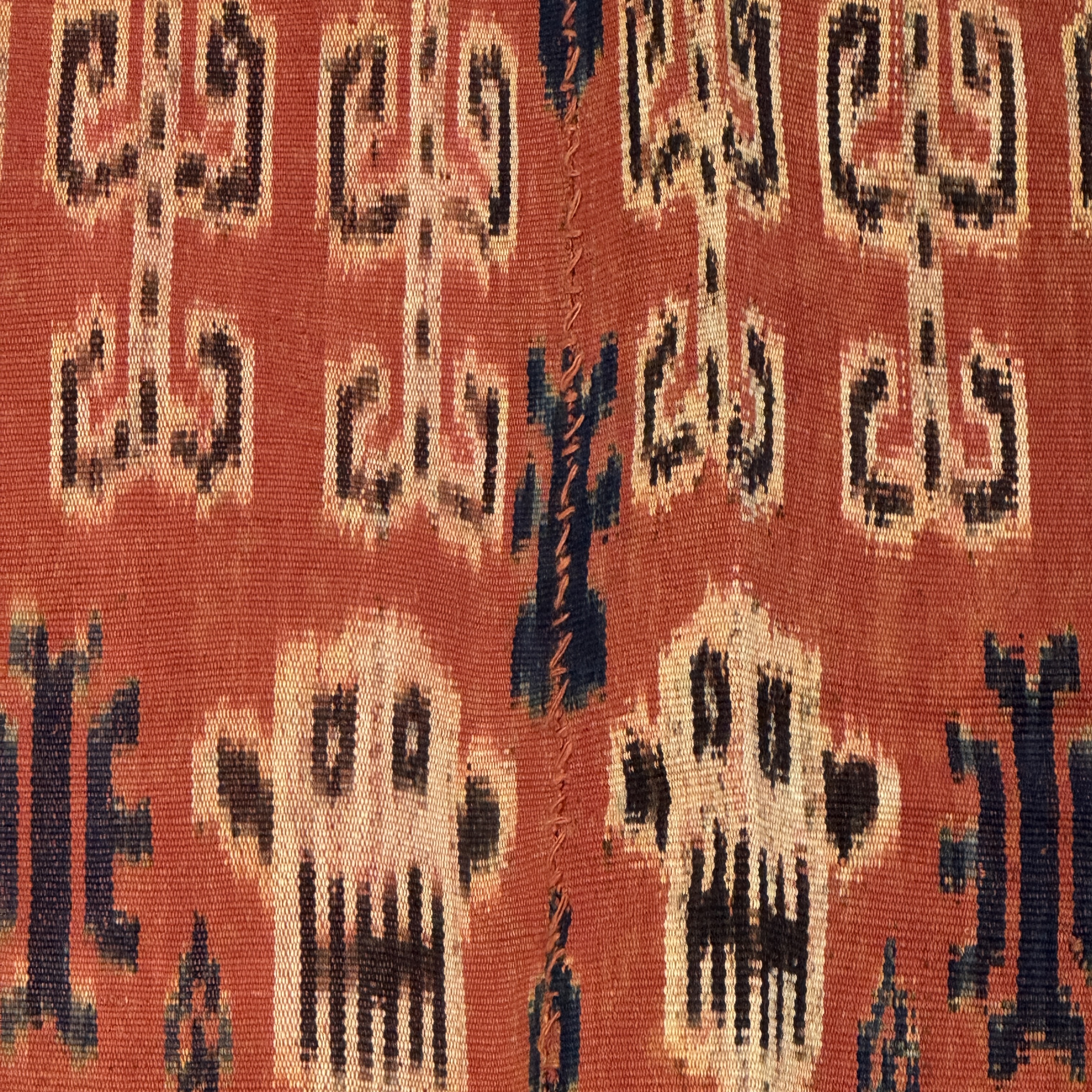 A hinggi shoulder cloth with warrior motifs and an Iban pua textile with human and animal motifs — photo 9