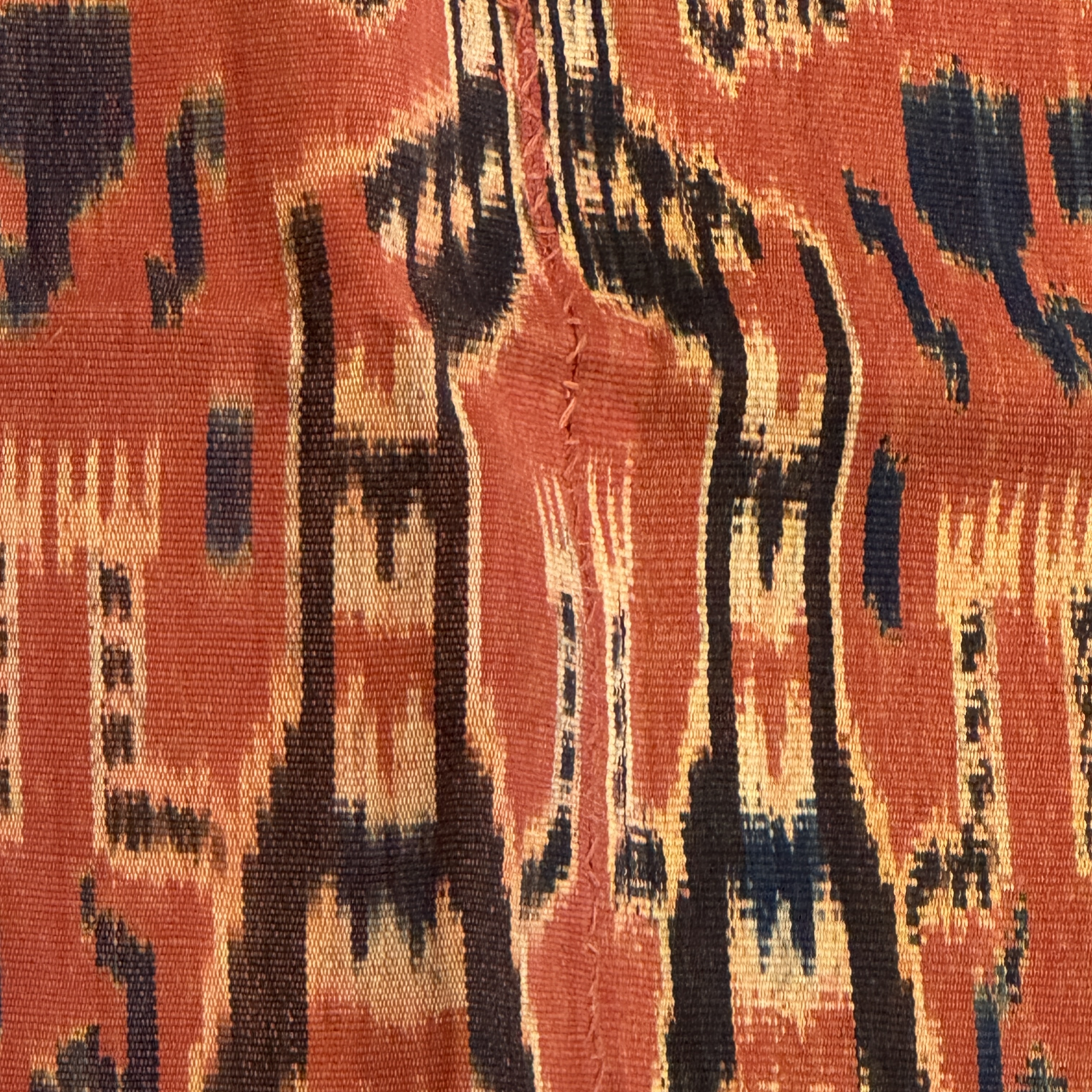 A hinggi shoulder cloth with warrior motifs and an Iban pua textile with human and animal motifs — photo 16