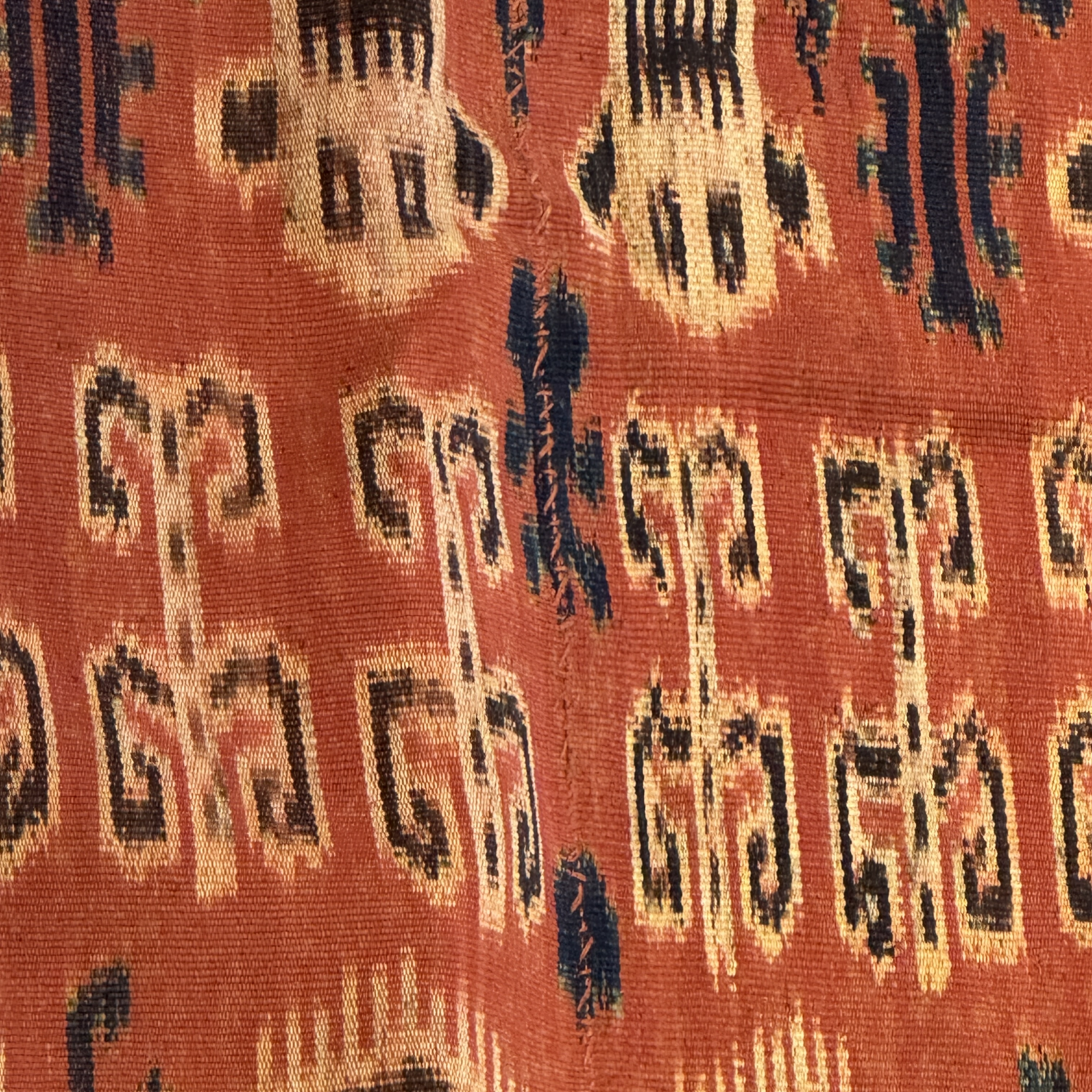A hinggi shoulder cloth with warrior motifs and an Iban pua textile with human and animal motifs — photo 18