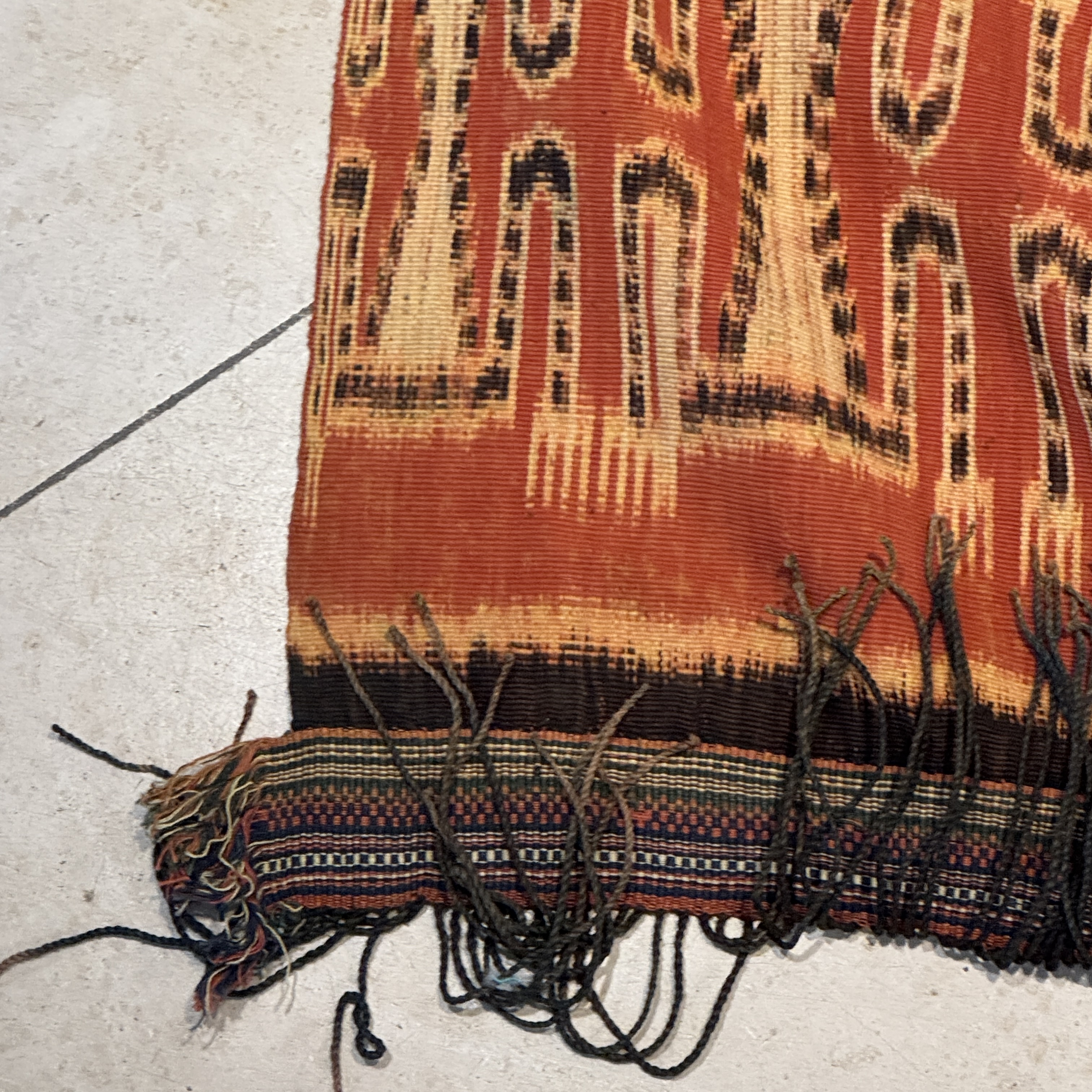 A hinggi shoulder cloth with warrior motifs and an Iban pua textile with human and animal motifs — photo 23