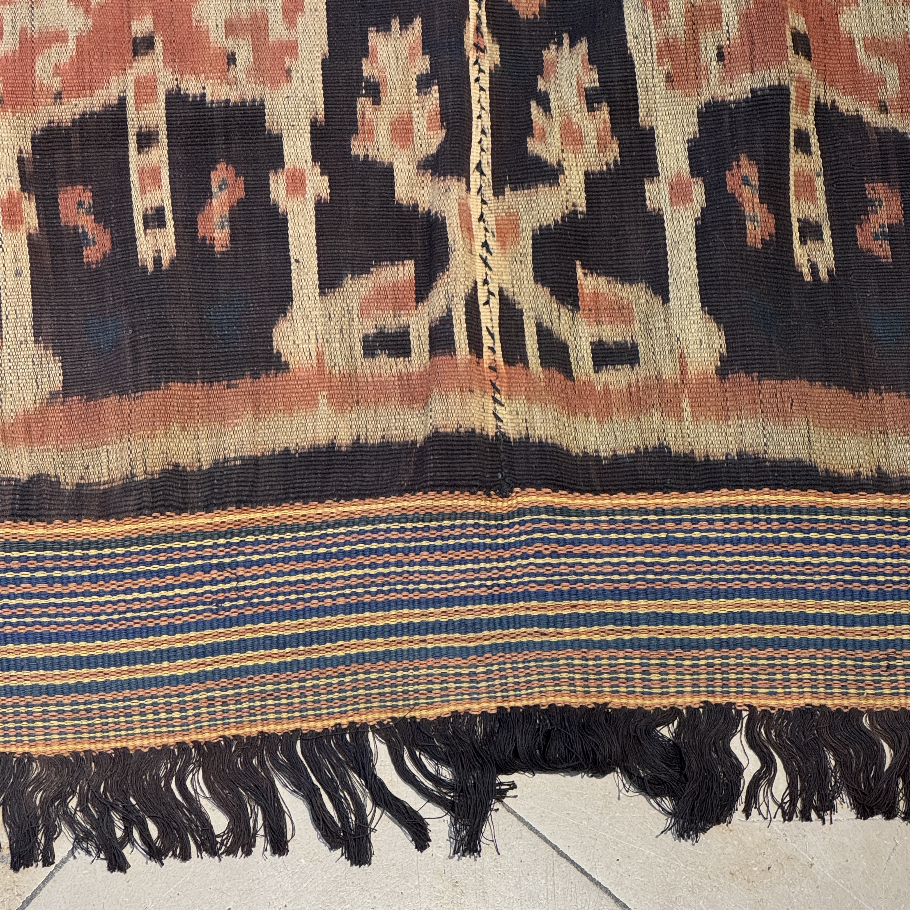A hinggi shoulder cloth with warrior motifs and an Iban pua textile with human and animal motifs — photo 26
