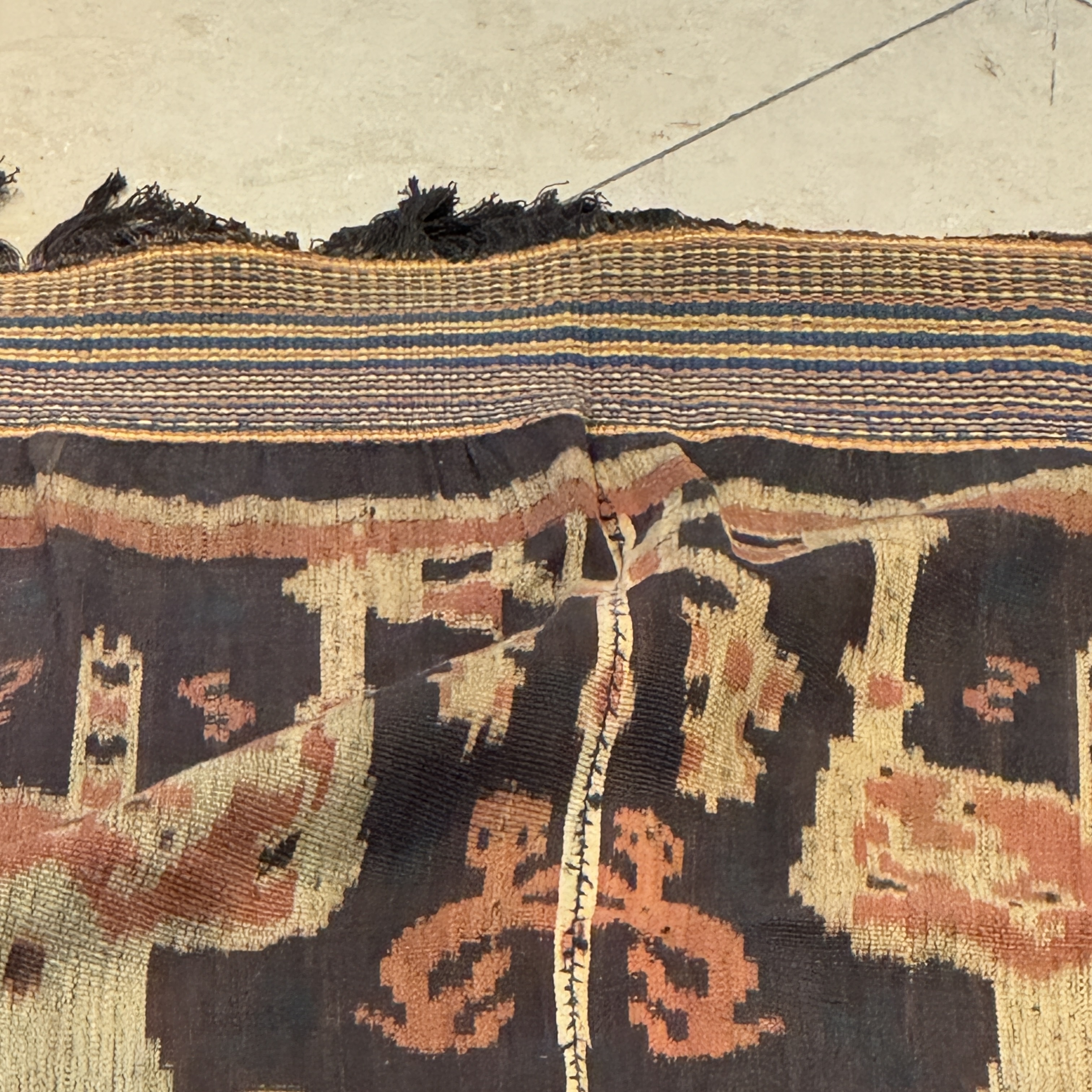 A hinggi shoulder cloth with warrior motifs and an Iban pua textile with human and animal motifs — photo 33