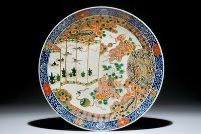 A Japanese Arita charger with mythical creatures, 19th C.