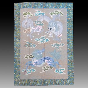 A Japanese embroidered wool and silk wall tapestry with a dragon and qilin, Meiji, 19th C. — photo 1