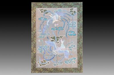 A Japanese embroidered wool and silk wall tapestry with two phoenixes, Meiji, 19th C.