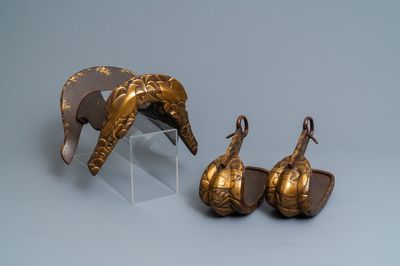 A Japanese gilt-lacquered 'kura' saddle with matching 'abumi' stirrups, Muromachi, 16th C.