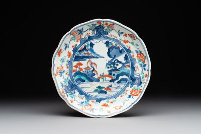A Japanese Hizen ware Kakiemon-style 'riverside landscape' plate, Edo, 17/18th C.