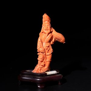 A Japanese red coral sculpture of a fisherman on wooden stand, 19/20th C. — photo 1