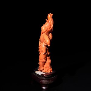 A Japanese red coral sculpture of a fisherman on wooden stand, 19/20th C. — photo 4