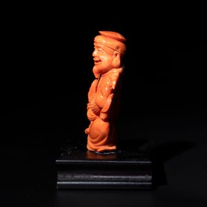 A Japanese red coral sculpture of a fisherman on wooden stand, 19/20th C. — photo 2