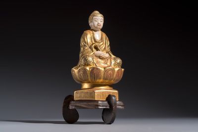 A Japanese Satsuma figure of Buddha seated on a lotus base, Hododa 保土田 mark, Meiji, 19/20th C.