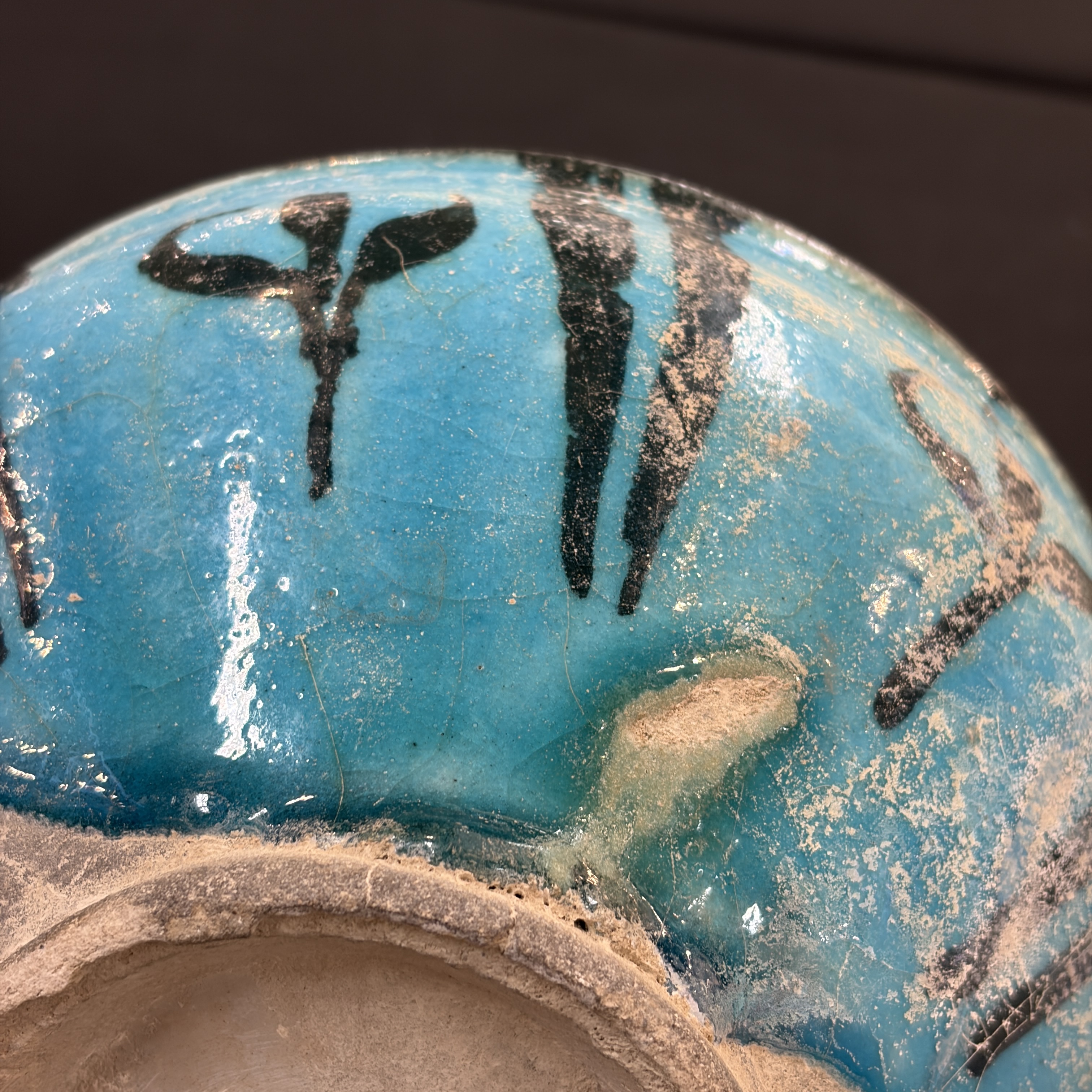 A Kashan black and turquoise pottery bowl with water-weed design — photo 13