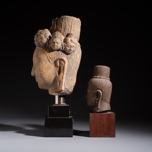 A Khmer-style carved stone head and a carved stone head of a deity, Cambodia and Thailand, 20th C. or earlier — photo 3
